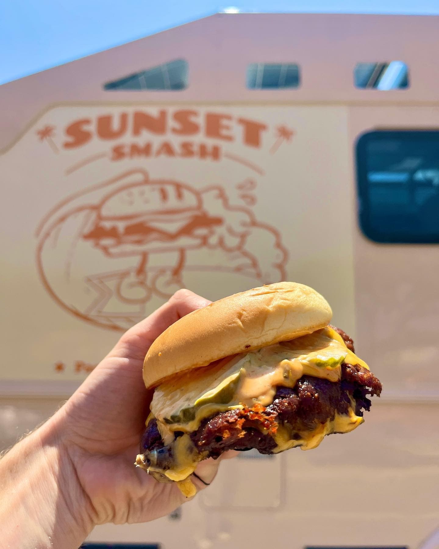 Sunset Smash burger and fries on a tray